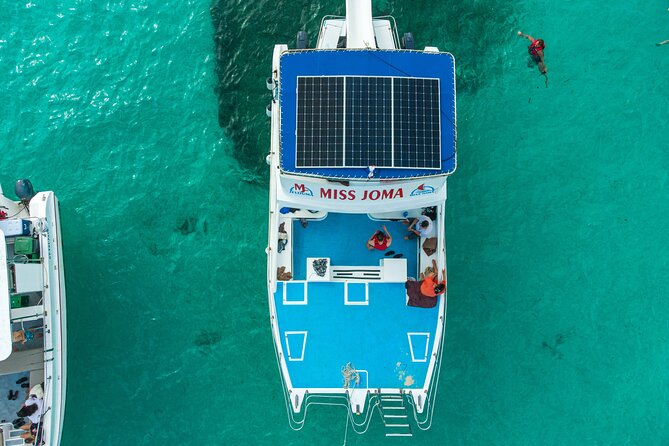 Experience for families and friends by private boat with pick-up - The crew energy is the product: animation, dances, and keeping you fed
