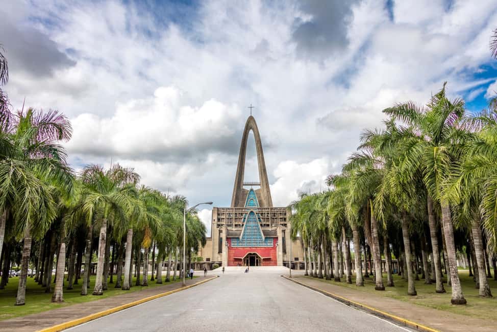 Higuey: Full-Day Tour with River Boat, Lunch, & Voodoo Show - Sacred shrines and the lamdark basilica you pass by