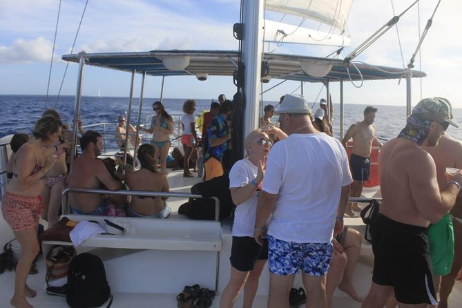 Party boat in Catamaran with Open Bar Only Adults + Snorkeling - Snorkeling at coral reefs: equipment included, timing varies