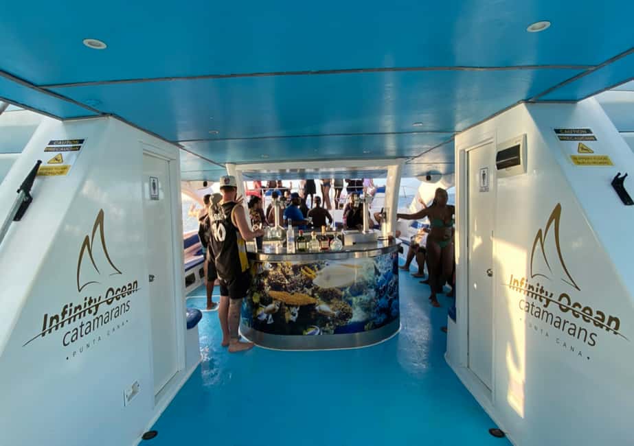 Punta Cana: Party Catamaran with Snorkeling & Private Beach - Boarding the Catamaran: Music, Animators, and Open-Deck Fun