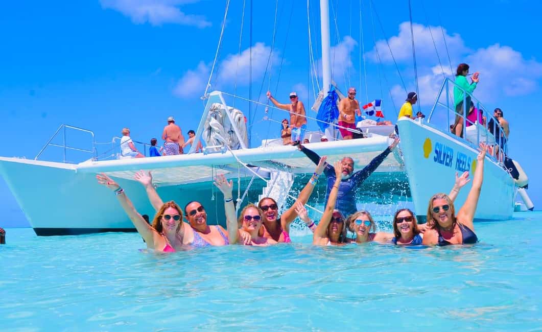 Punta Cana: Saona Island Catamaran Adventure with Lunch - The Natural Pool Stop: starfish hunting in shallow, calm water