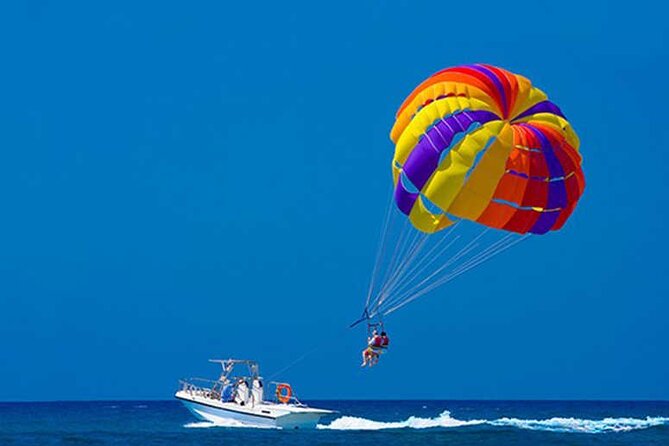 Snuba Snorkelking Parasailing and Catamaran Pack - Onboard Fun: Music, Animation, Drinks, and Lunch